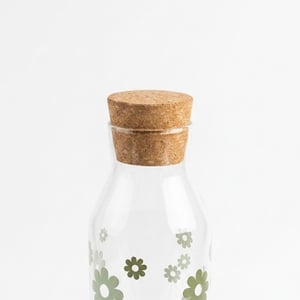 Botella de vidrio flor